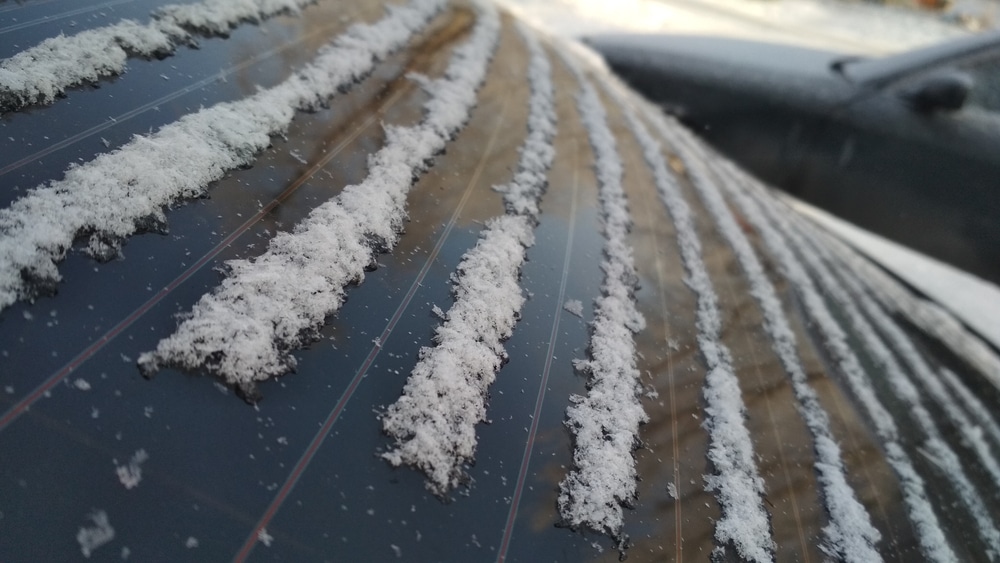 lines of the snowflakes between window defroster lines of rear window in the winter cold weather